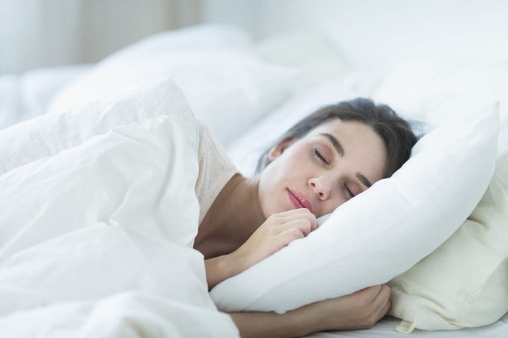 Usa, New Jersey, Jersey City, Woman Sleeping In Bed